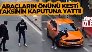 Beyoğlu'da araçların önünü kesti, taksinin kaputunun üzerine yattı